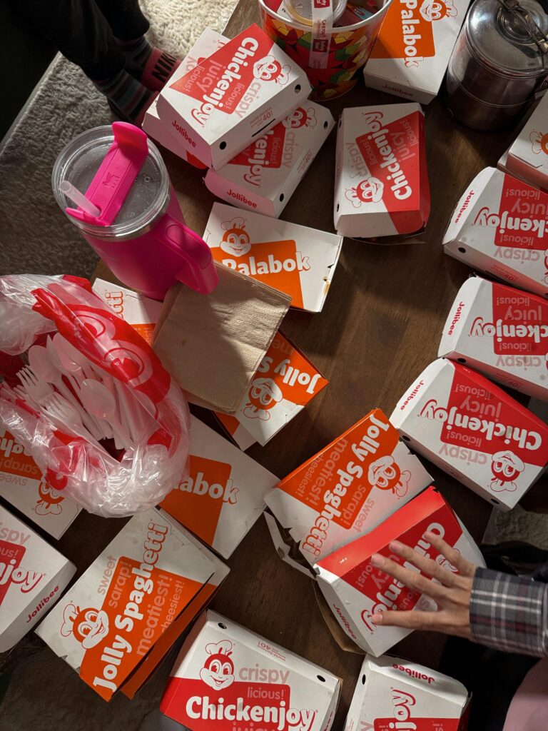 Jollibee meal boxes arranged on a table in Maasin City, Philippines.